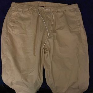 Large semi stretchy khaki pants. Beige type colour. Very stylish to go with fits